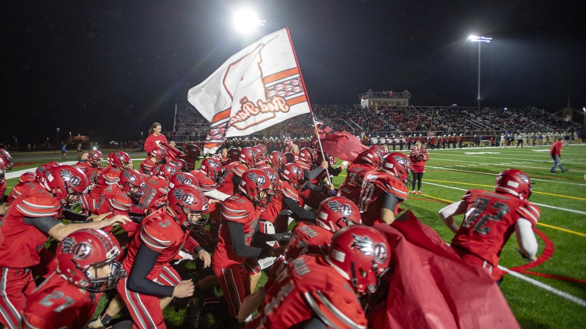 Bellefonte football runs onto the field at the newly renovated Rogers Stadium for the  Curtin Bowl against Bald Eagle Area on Friday, Oct. 26, 2018.