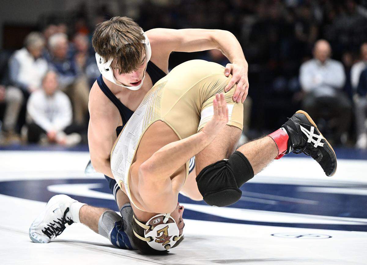 Penn State's Marcus Blaze (top) takes down Lehigh's Mason Ziegler at 133 pounds during a match Sunday, Dec. 7, 2025 at Rec Hall in State College. Blaze defeated Ziegler, 19-4. Penn State defeated Lehigh, 36-6.