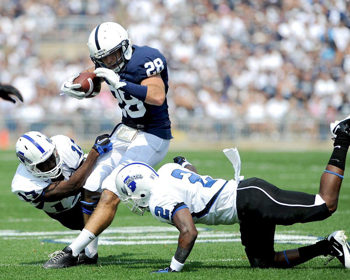 Penn State’s Drew Astorino advances down the field with the ball past Indiana State defenders Ednut Egberongbe and Leonard Riston after he intercepted the ball during the Saturday, Sept. 3, 2011 game.