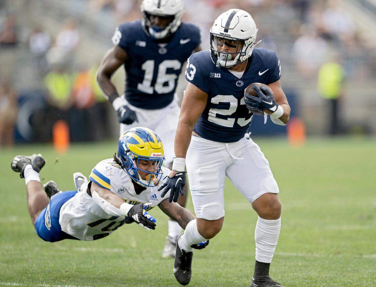 Delaware’s Keeno Arrington can’t stop Penn State running back Trey Potts during the game on Saturday, Sept. 9, 2023.