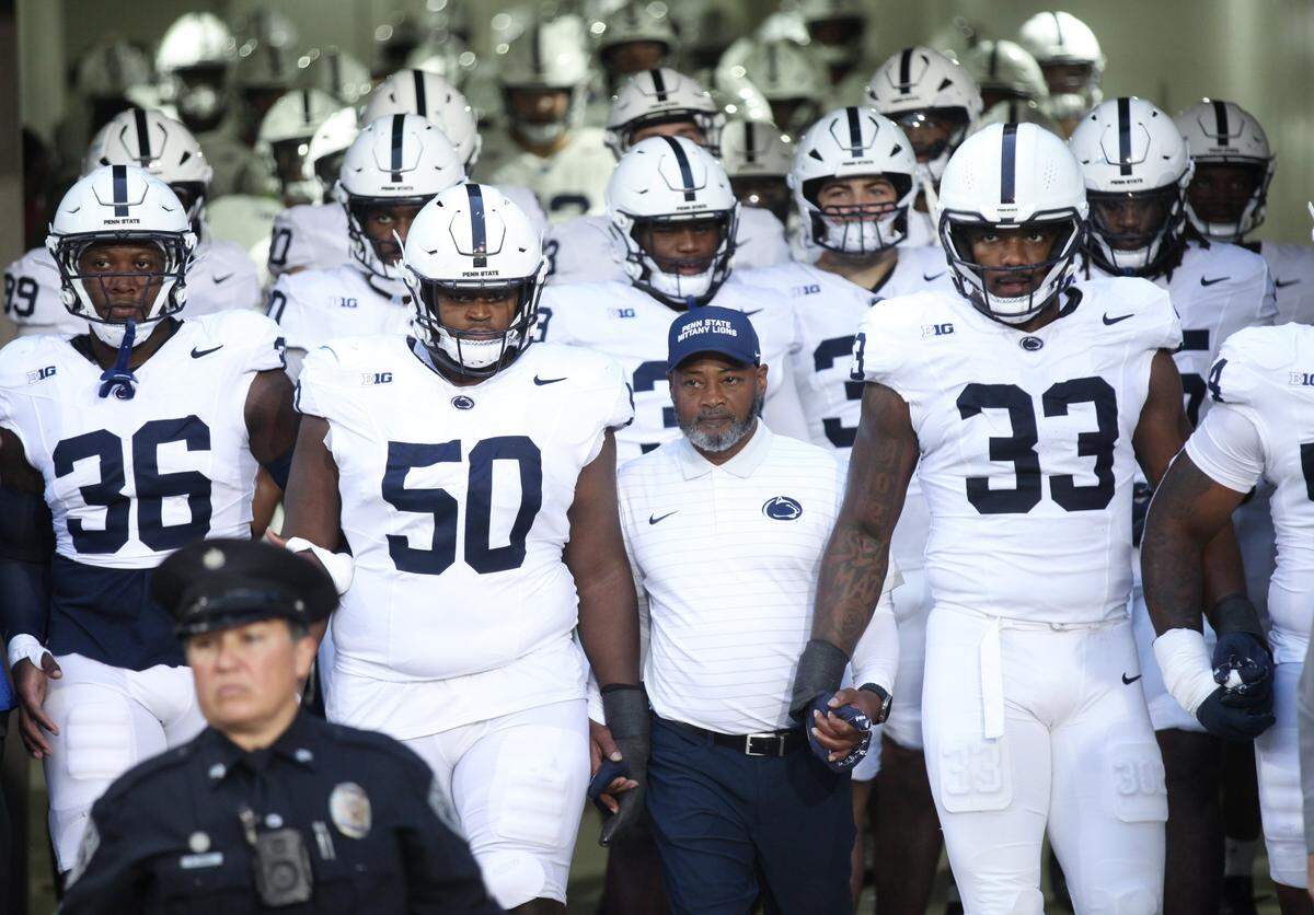 IOWA CITY, IA - OCTOBER 18: Interim head coach Terry Smith of the Penn State Nittany Lions walks out with this team before the match-up against the Iowa Hawkeyes on October 18, 2025 at Kinnick Stadium, in Iowa City, Iowa. (Photo by Matthew Holst/Getty Images)