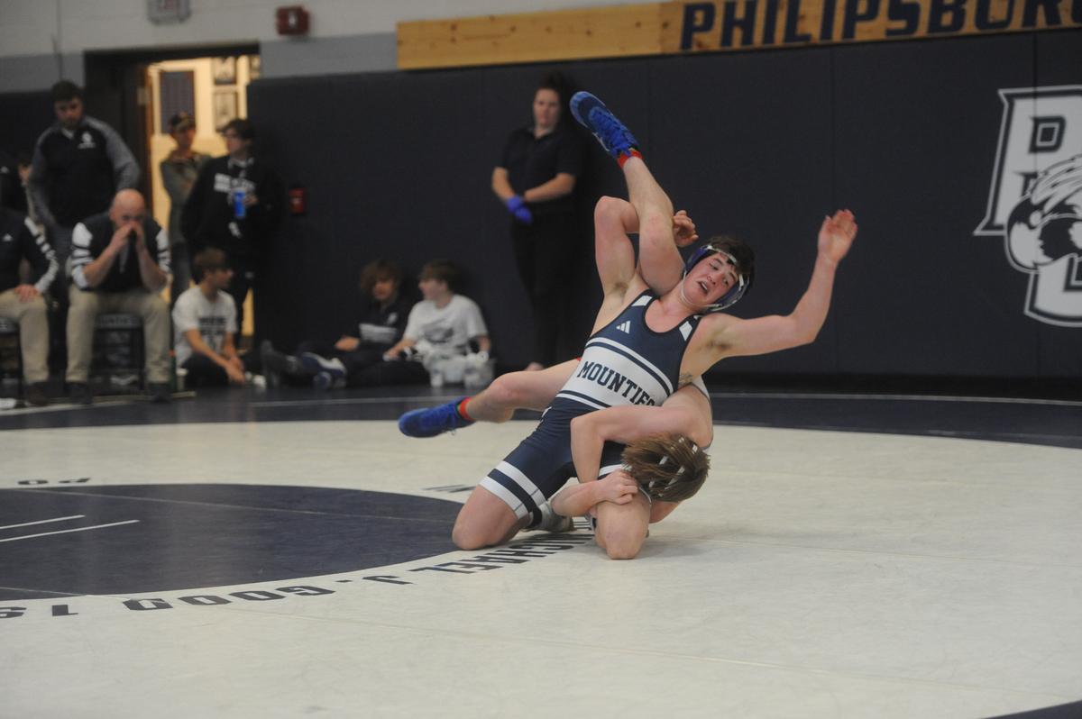 Philipsburg-Osceola’s Ian Phillips looks to roll through during a scramble with Bellefonte’s Jack McHail in their 152 pound bout of the Mounties’ 37-22 loss on Saturday, January 7, 2023 in the Mountaineer Duals at Philipsburg. Phillips beat McHail, 12-3.