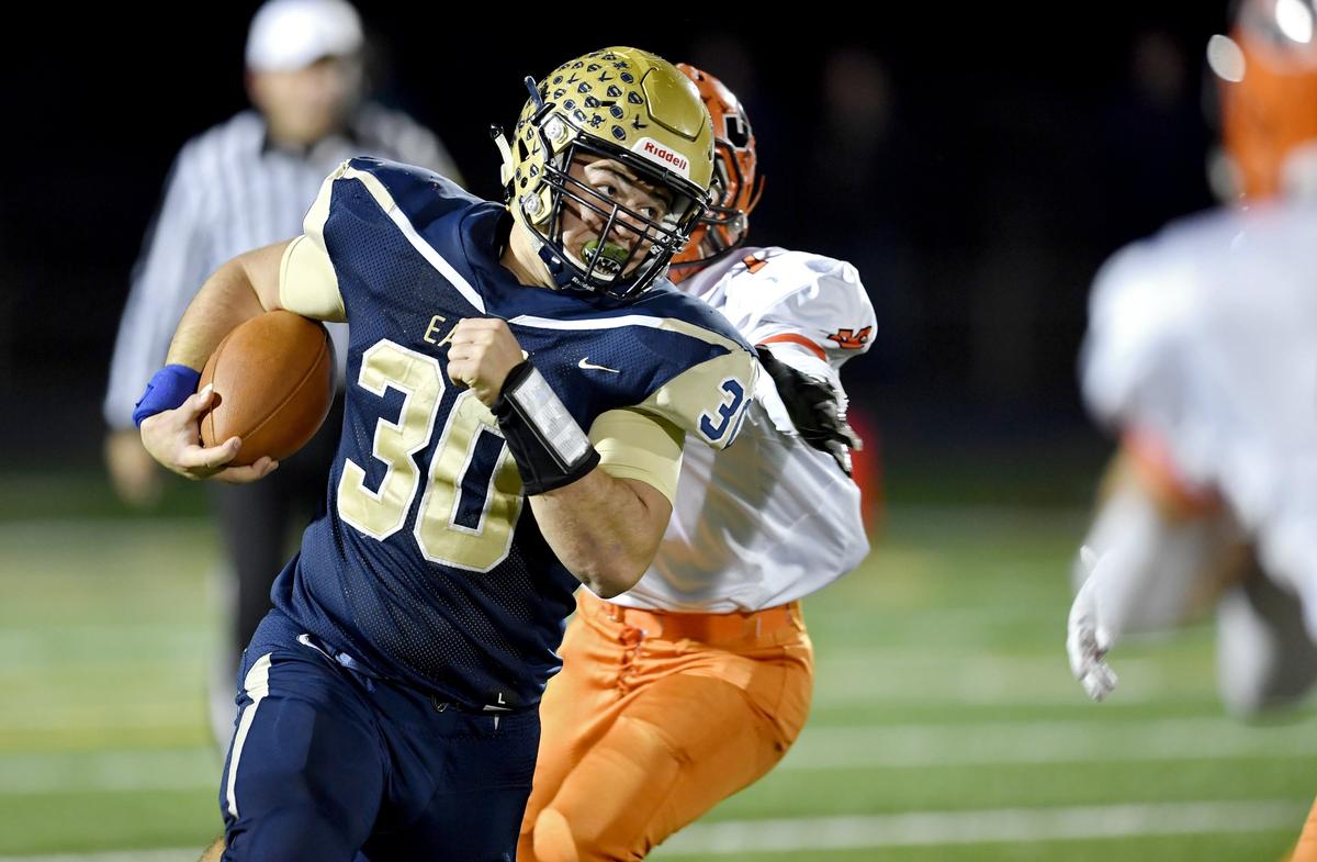 Bald Eagle Area’s Tommy Snyder runs from Jersey Shore defenders during the game on Friday, Oct. 18, 2019.