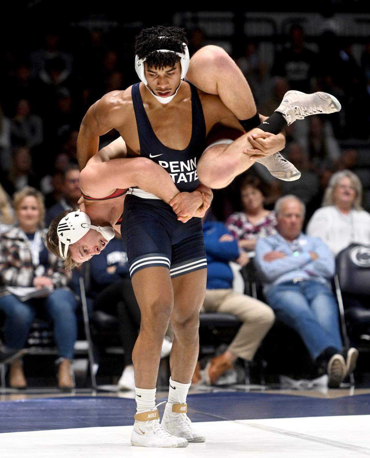 Penn State’s Carter Starocci walks with Lock Haven’s Tyler Stoltzfus on his back in the 174 lb bout of the match on Friday, Nov. 11, 2022.