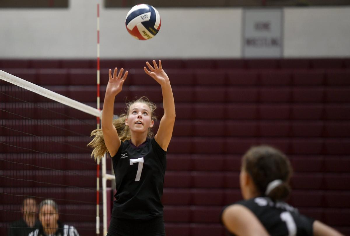 State College’s Kacy Sekunda sets the ball to Vanessa McGhee during the match against Red Land on Thursday, Sept. 26, 2019.