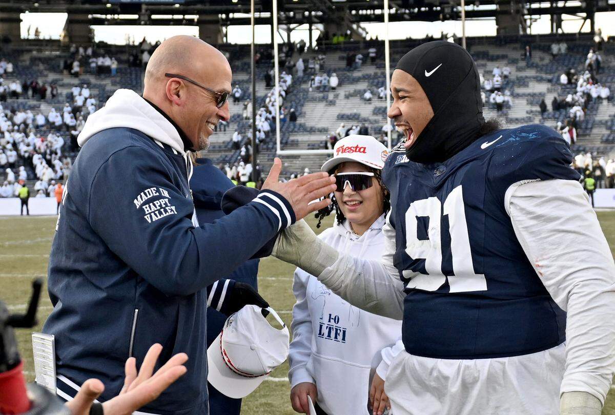 Penn State football coach James Franklin and defensive tackle Dvon J-Thomas celebrate the win over SMU on Saturday, Dec. 21, 2024 at Beaver Stadium.