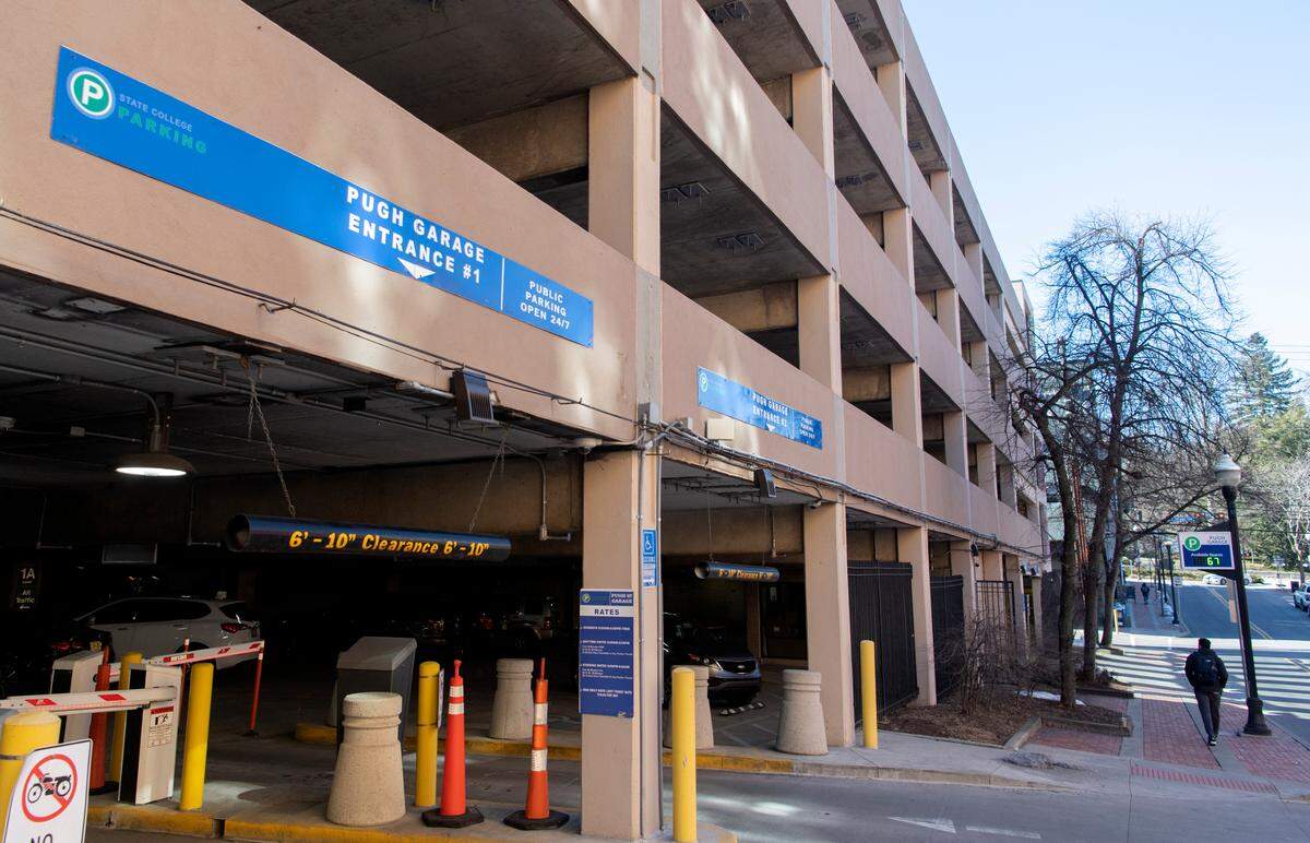 A pedestrian walks by the The Pugh Street garage on Tuesday, March 2, 2021.