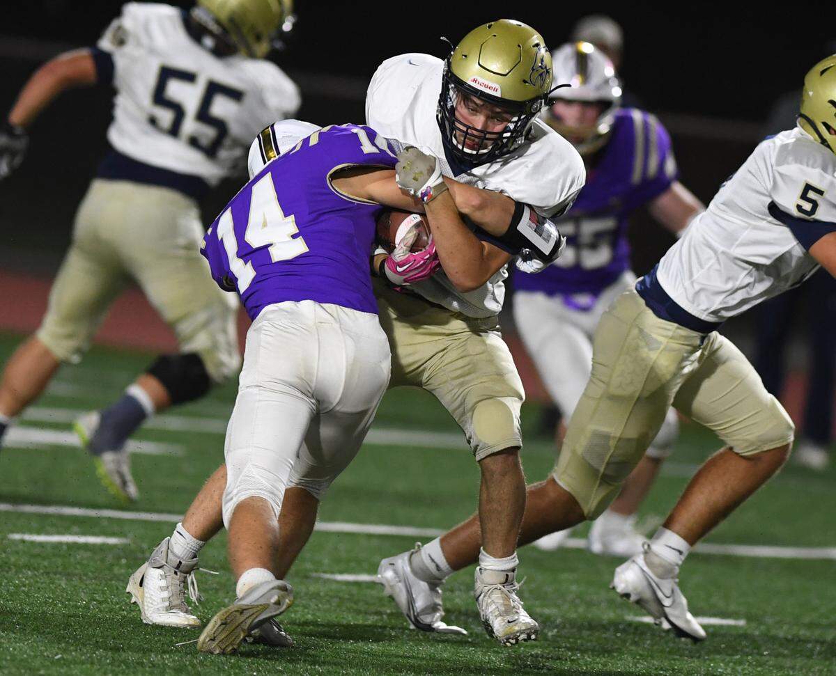 Bald Eagle Area’s Nick McCully is brought down by Bishop Guilfoyle’s Jack Gioiosa in the third quarter Saturday at Altoona’s Mansion Park.