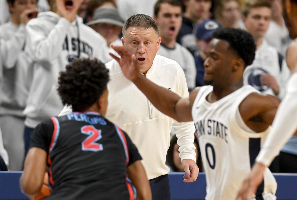 Penn State men’s basketball coach Mike Rhoades yells to Kanye Clary as he defends Delaware State’s Corey Perkins during the game on Monday, Nov. 6, 2023.