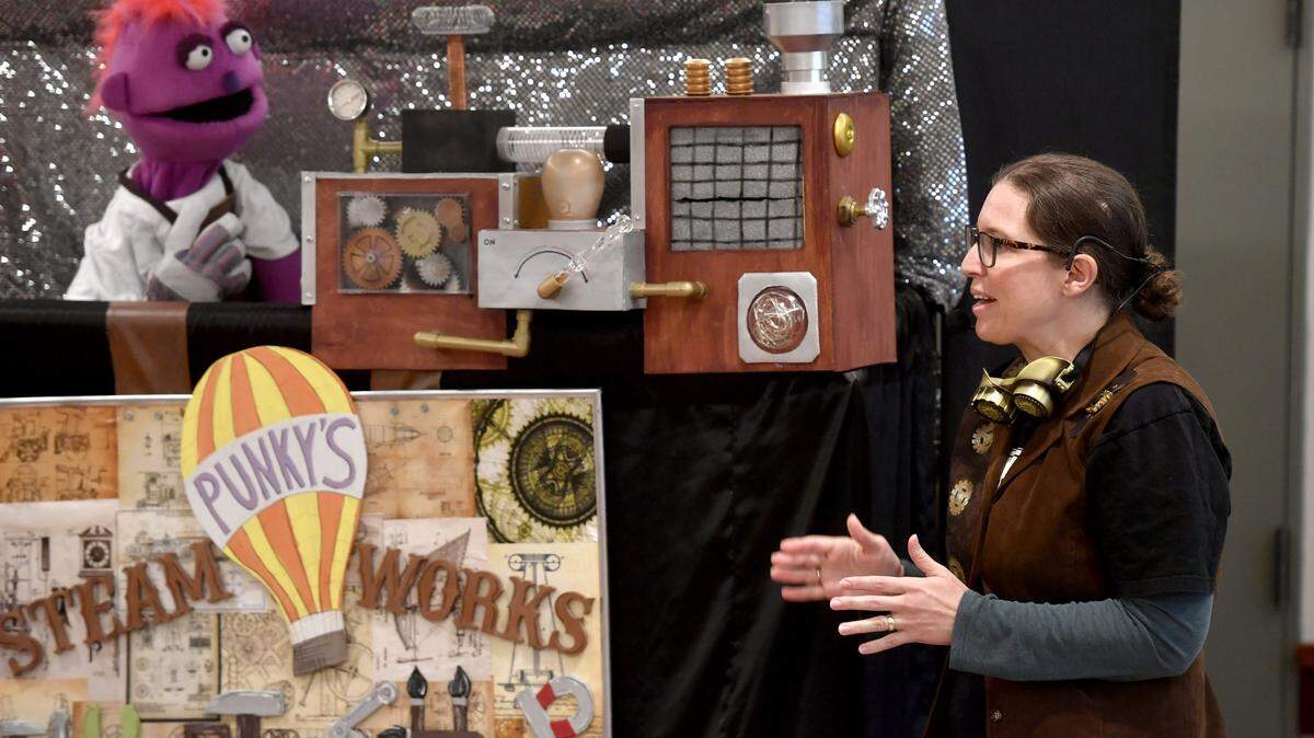 Kathy Swartz as character Tes talks to puppet Jack during a performance of Punky's Steam Works on July 6, 2017 at the Schlow Centre Region Library.  Puppet shows for adults and kids are part of the inaugural Central PA Dance Festival.