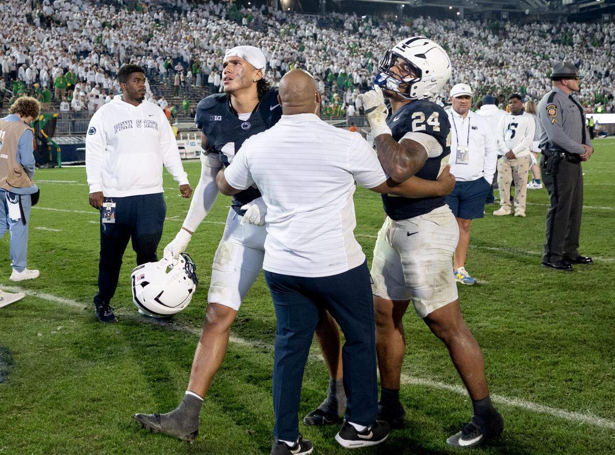 Penn State linebackers Tony Rojas and Amare Campbell walk off the field in frustration after the loss to Oregon on Saturday, Sept. 27, 2025.  