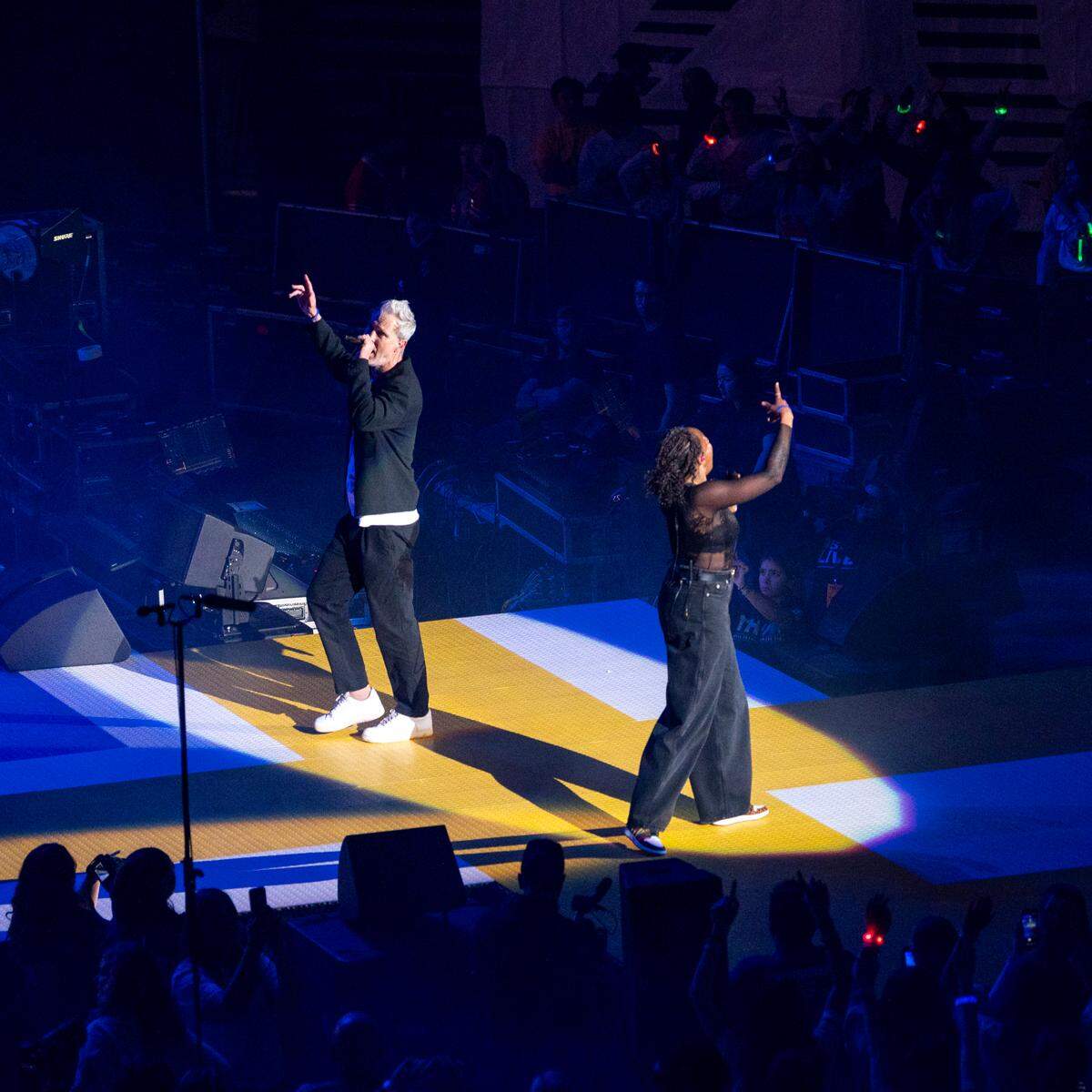 Fitz and The Tantrums singers Fitz, left, and Noelle Scaggs sing in unison during their national act performance during Penn State ‘sThon on Friday, Feb. 20, 2026.