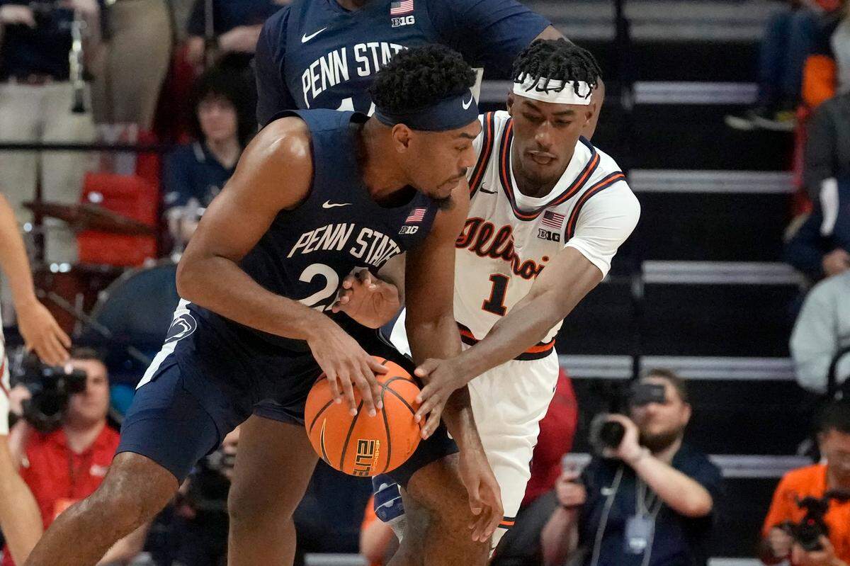 Illinois guard Sencire Harris (1) pressures Penn State guard Jalen Pickett during the first half of an NCAA college basketball game Saturday, Dec. 10, 2022, in Champaign, Ill. (AP Photo/Charles Rex Arbogast)