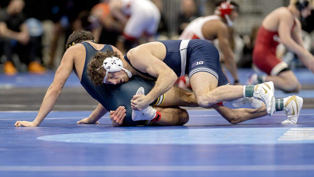 Penn State's Levi Haines controls Michigan’s Beau Mantanona in a 174-pound quarterfinal bout at the NCAA wrestling championships on Friday, March 20, 2026.