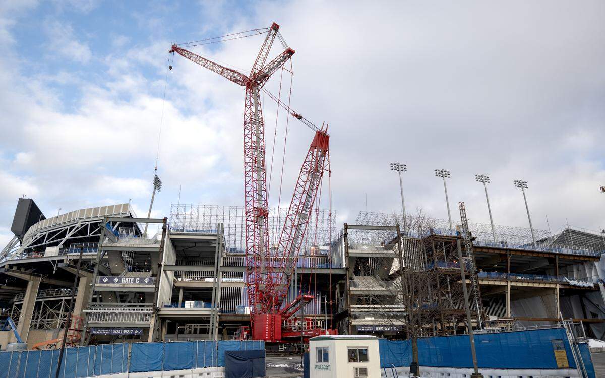 A crane moves lights on the west side of Beaver Stadium as renovations continue on Wednesday, Dec. 3, 2025.