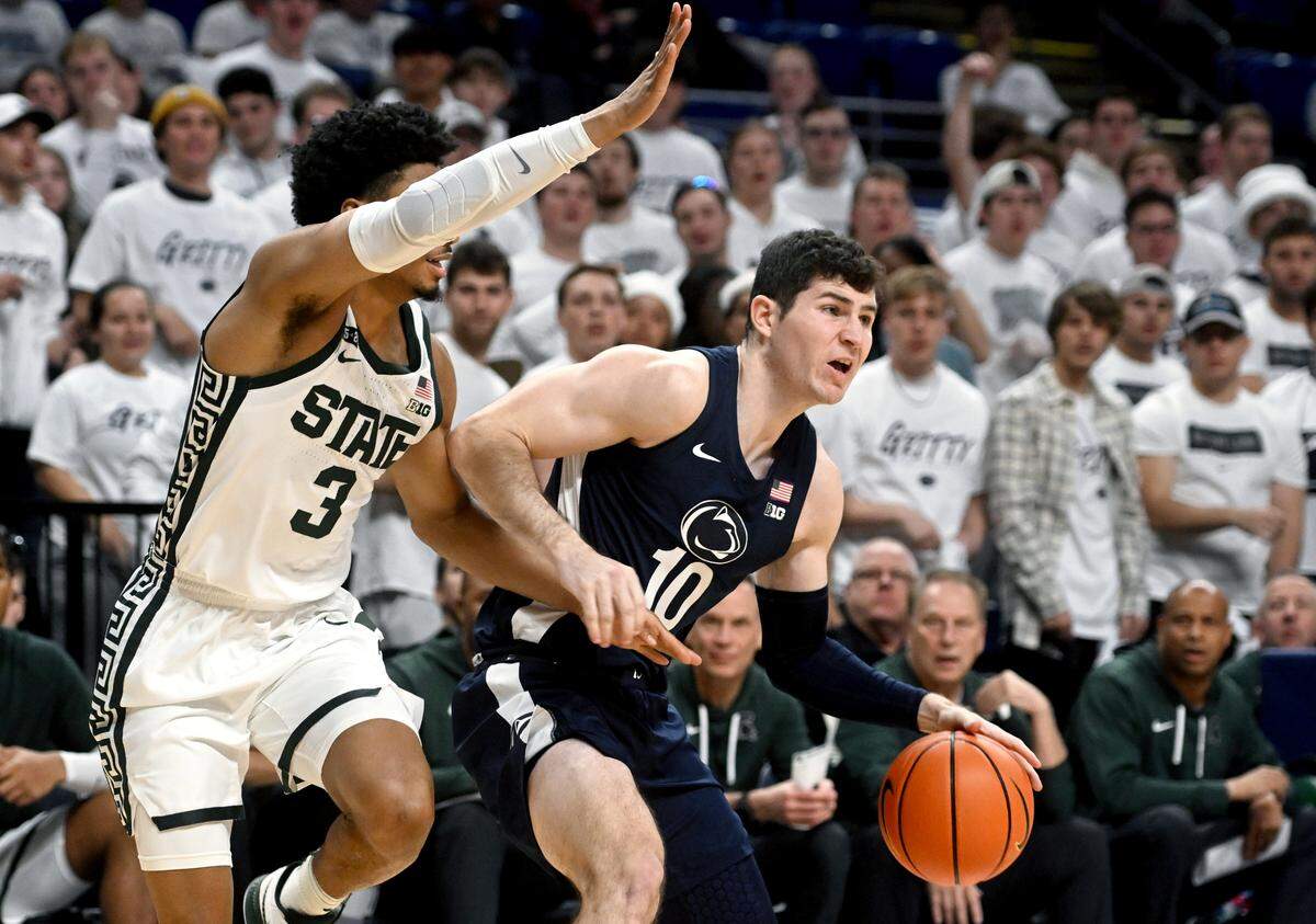 Penn State’s Andrew Funk tires to push around Michigan State’s Jaden Akins during the game on Wednesday, Dec. 7, 2022.