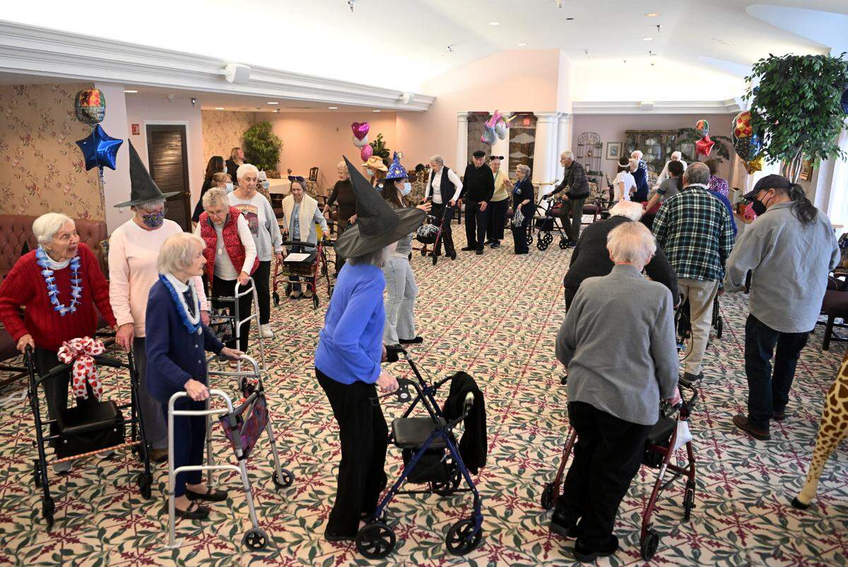 Residents at Juniper Village at Brookline Senior Living do the “LocoMotion” and dance for 46 minutes in support of Penn State’s Thon on Monday.