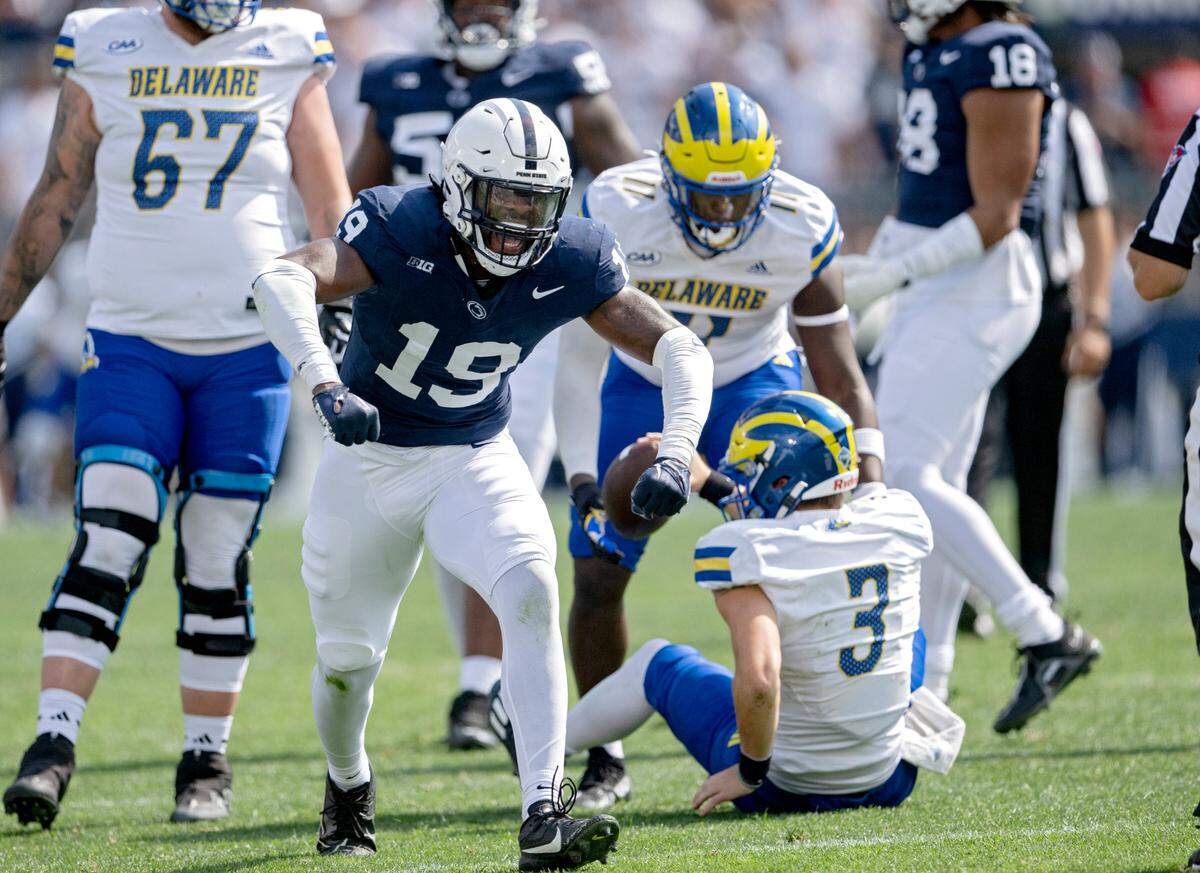 Penn State defensive end Jameial Lyons celebrates stopping Delaware’s Zach Marker during the game on Saturday, Sept. 9, 2023.