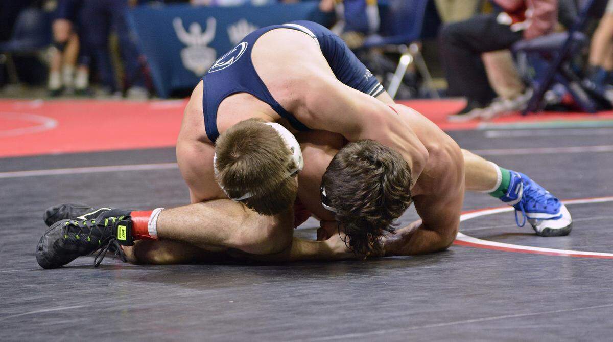 Penn State’s Jason Nolf locks up a cross-face cradle on Stanford’s Dom Mandarino in their 157-pound semifinal match of the Southern Scuffle on Wednesday in Chattanooga, Tenn. Nolf pinned Mandarino in 5:22 for his 54th career pin, which set a new mark for the Nittany Lions.