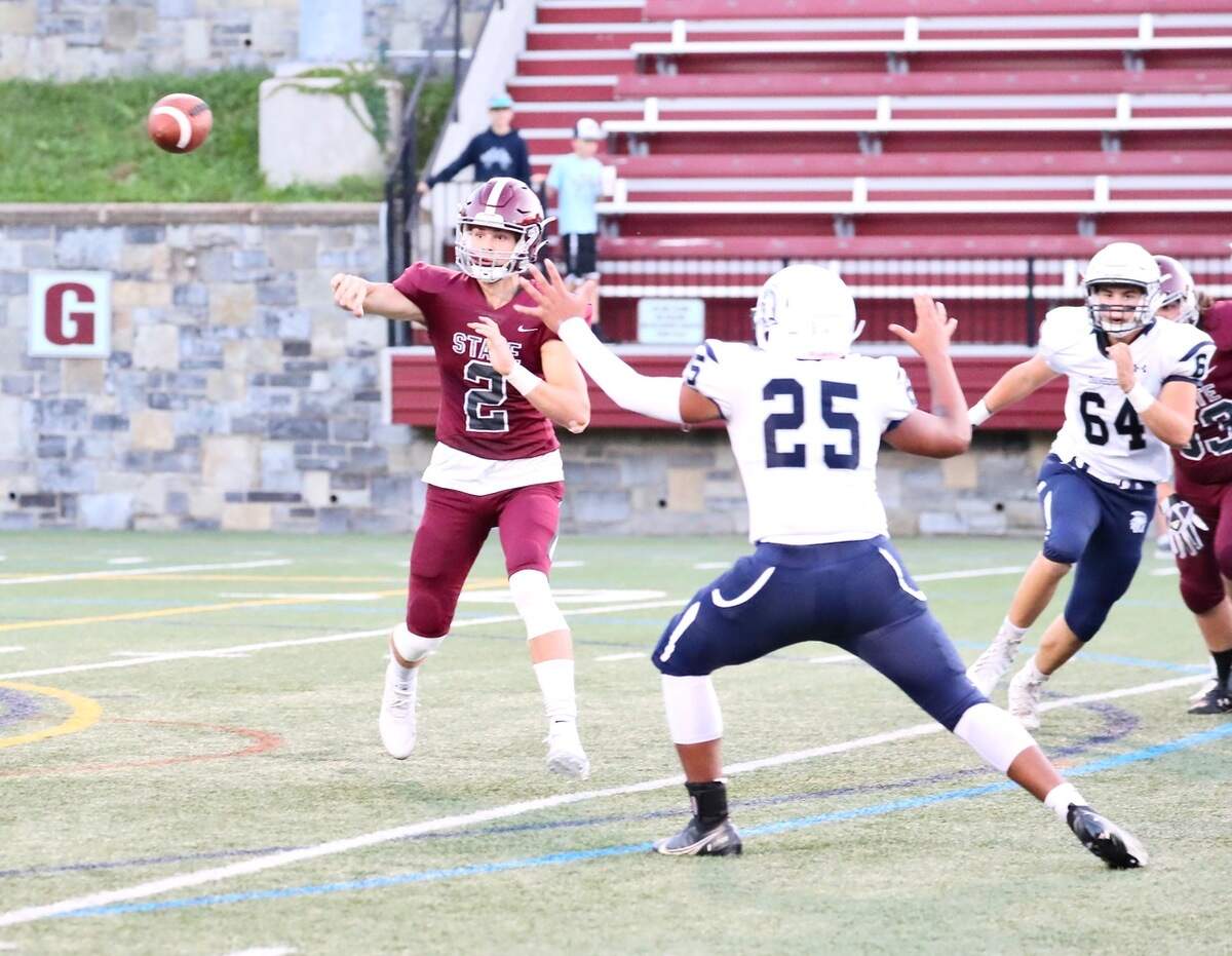 State College’s Finn Furmanek looks to make a pass against Chambersburg at Memorial Field on Sept. 17, 2021. State College won, 38-22.