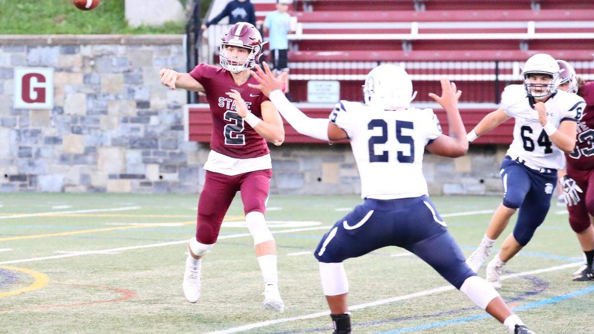 State College’s Finn Furmanek looks to make a pass against Chambersburg at Memorial Field on Sept. 17, 2021. State College won, 38-22.