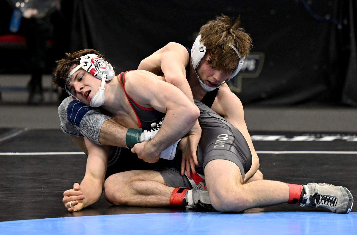 Ohio State’s Ben Davino and Penn State's Marcus Blaze wrestls in a 133-pound semifinal bout of the NCAA wrestling championships on Friday, March 20, 2026.