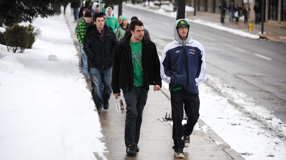 People dressed in green for State Patty's Day walk along Beaver Avenue to get to house parties since few bars were open early Saturday, Feb. 27, 2010. CDT/Michelle Bixby