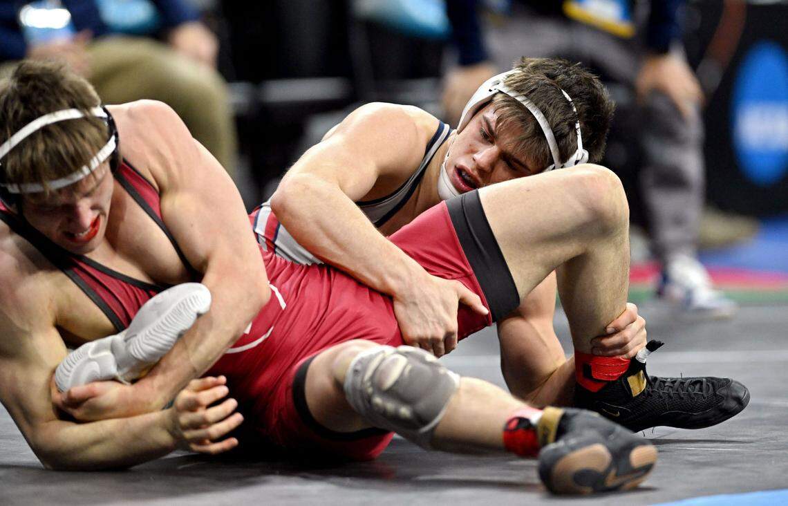 Penn’s Jude Swisher wrestles Harvard’s James Harrington in a 157-pound bout during the 2025 NCAA Wrestling Championships in Philadelphia on Friday, March 21, 2025.  