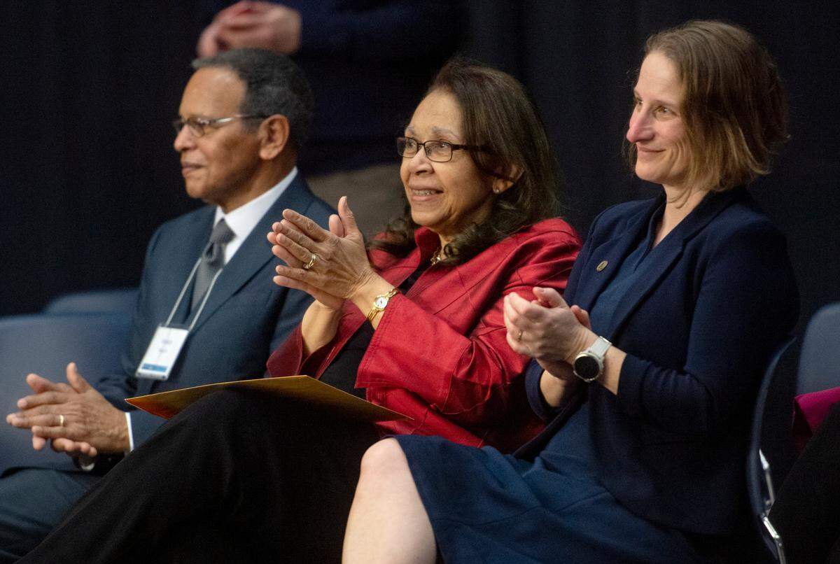 Shirley M. Malcom (center) claps along with Penn State choir Essence of Joy during a celebration on Friday. The 329 Building at Innovation Park has been renamed the “Shirley M. Malcom Building.”