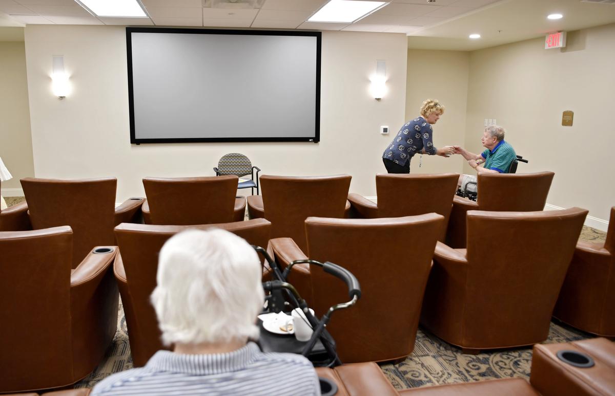 Residents gather in the movie theater for a discussion at Harmony at State College on Sept. 18.