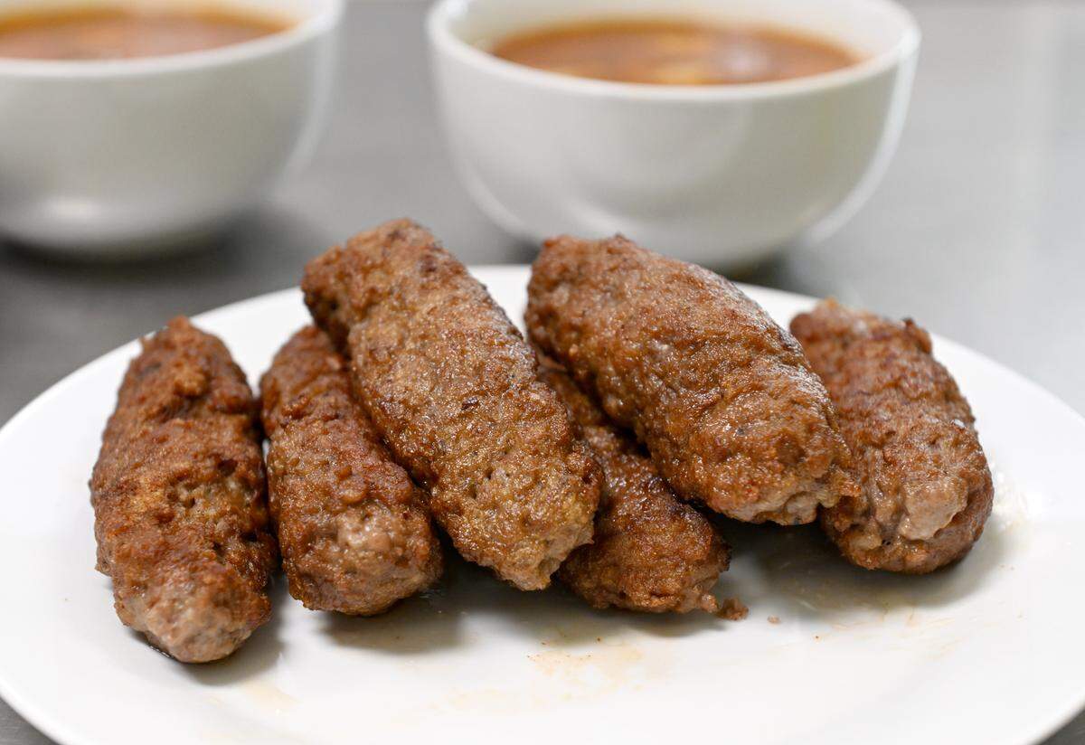 Mici, a traditional Romanian skinless sausage from Taste of Transylvania, is pictured on Tuesday, May 19, 2026. 