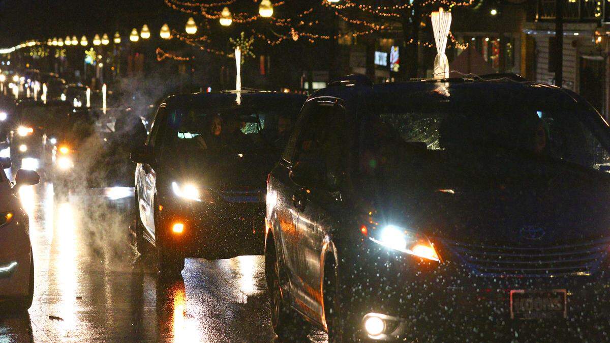 Centre County and State College have seen rain this December — such as here during the Dec. 10 Menorah Car Parade in downtown State College — but they’ve also seen less than an inch of snow. It’s been an unseasonably warm December, according to the data.