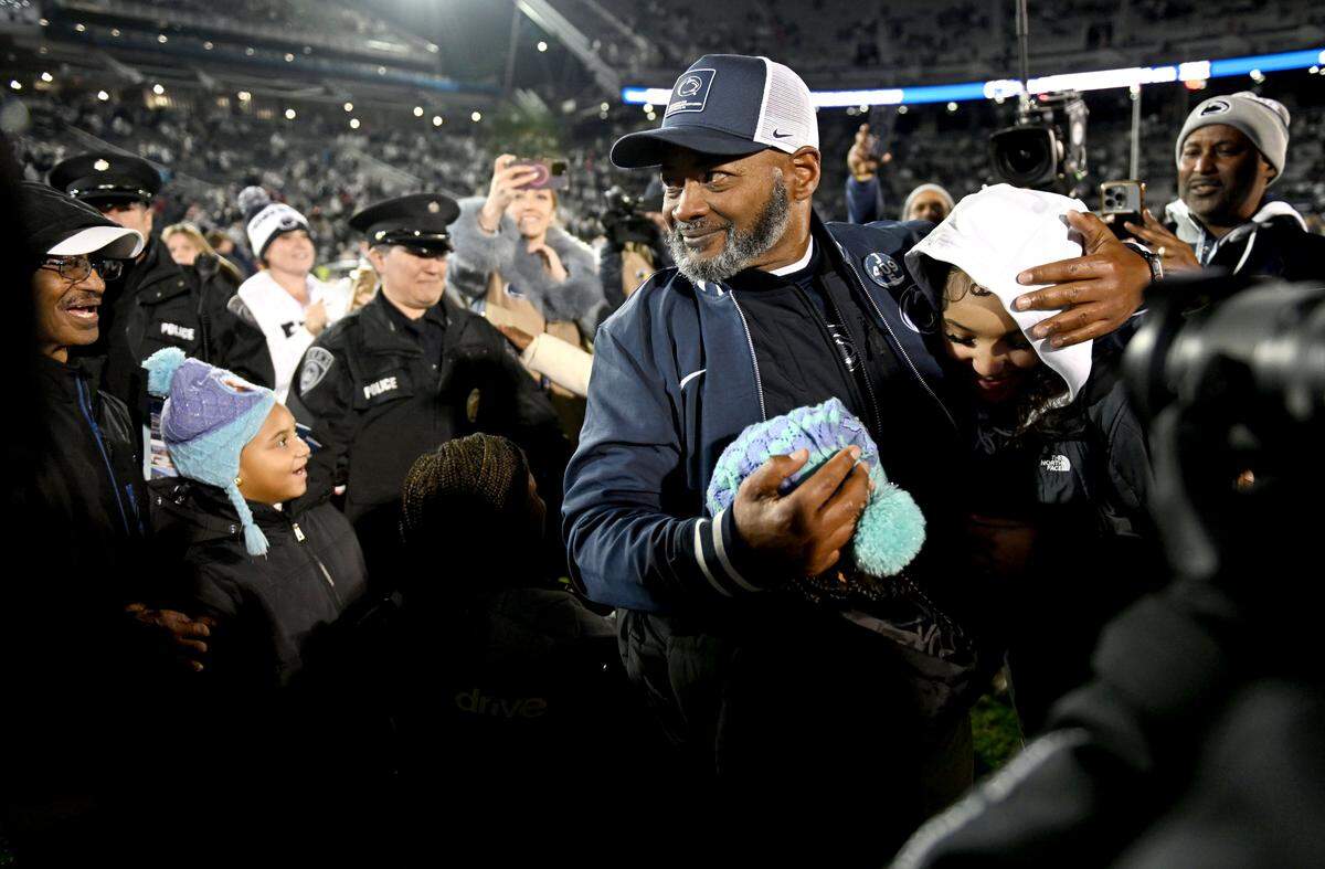Penn State interim coach Terry Smith is congratulated by family and friends after the win over Nebraska on Saturday, Nov. 22, 2025 at Beaver Stadium.