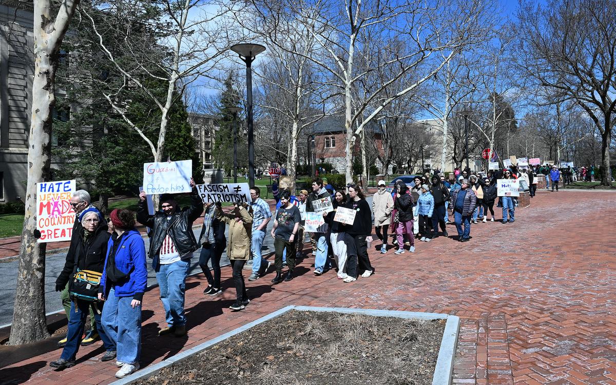 Protesters marched through the Penn State campus following a rally as part of the No Kings anti-Trump rally on Saturday.