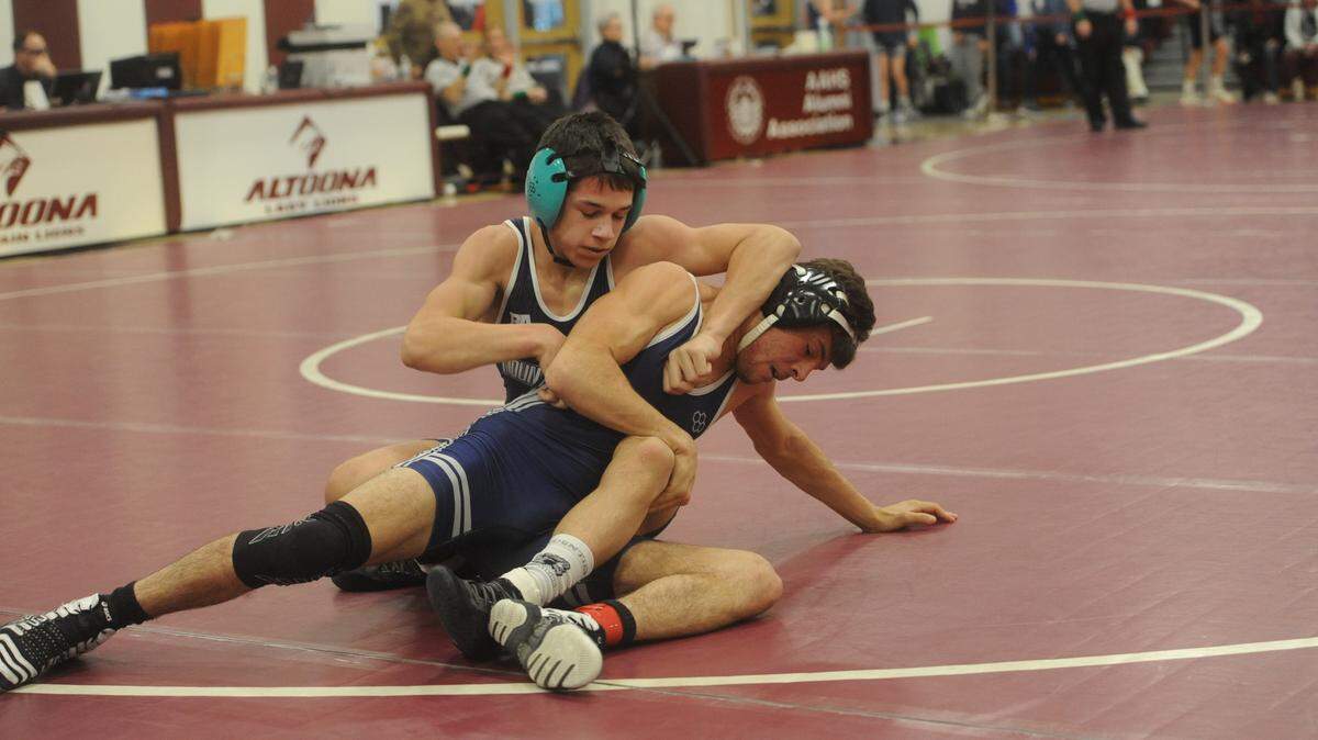 Philipsburg-Osceola’s Marcus Gable (left) and Penns Valley’s Nate Long scramble during their 132-pound quarterfinals match of the District 6 Class 2A Championships on Friday, Feb. 18, 2022. Gable topped Long, 13-4.