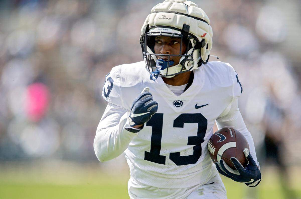 Penn State running back Kaytron Allen runs down the field with the ball during the Blue-White game on Saturday, April 23, 2022.