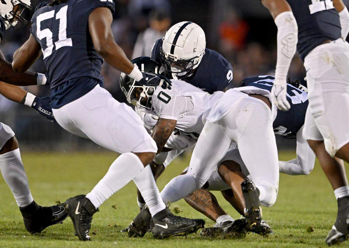 Penn State cornerback Joey Porter Jr. stops Michigan State’s Keon Coleman during the game on Saturday, Nov. 26, 2022.