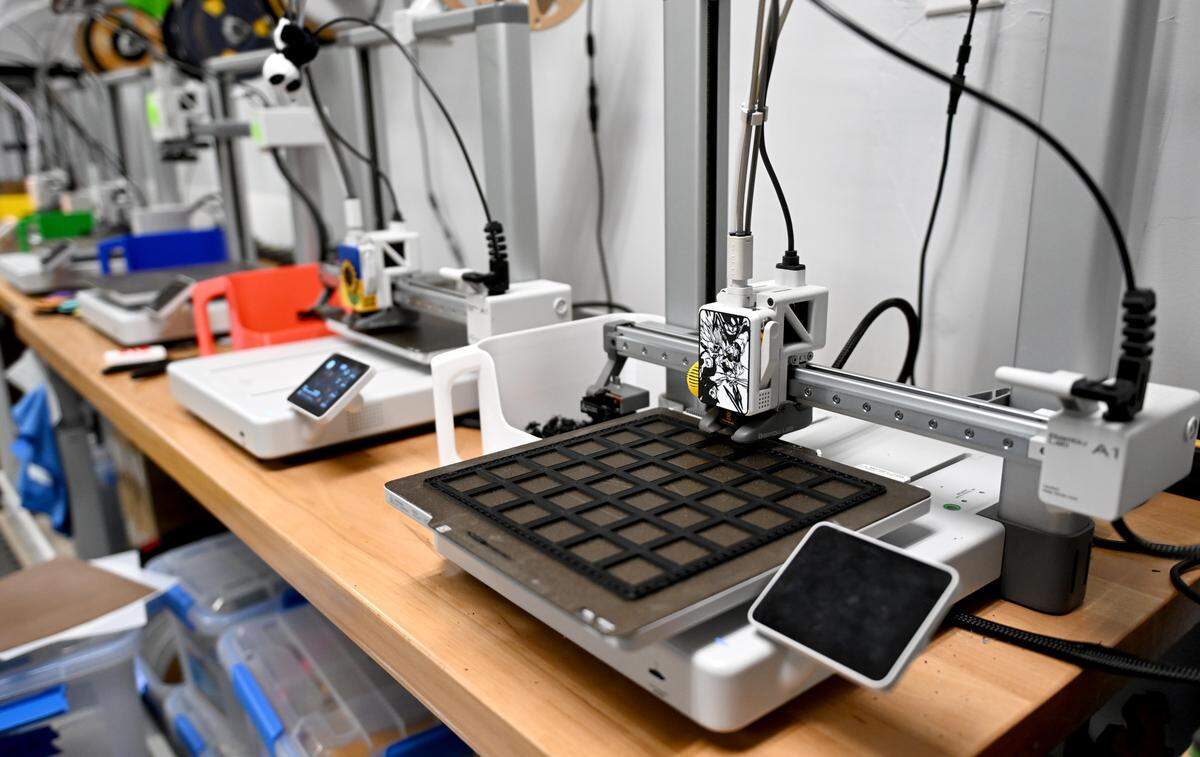 A 3D printer makes game accessories at Lizzy’s Toy Box in Bellefonte on Monday, Jan. 12, 2026.