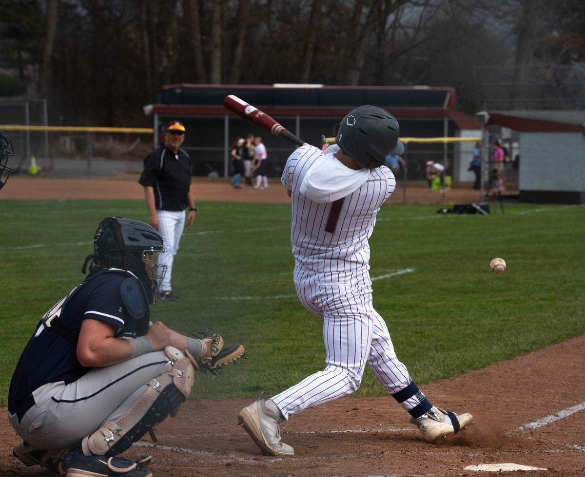 State College’s Jake Hall hits the ball during a baseball game against Chambersburg in State College, Pa., on Tuesday, March 31, 2026. The Little Lions beat the Trojans 1-0.