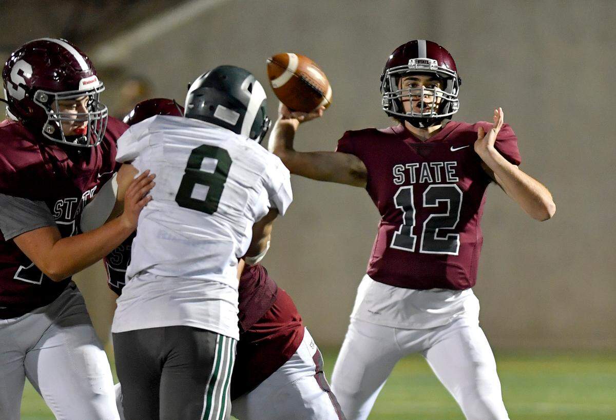State CollegeÕs Ian Brandt makes a pass during the game against Central Dauphin on Friday, Oct. 1, 2021 at Memorial Field.