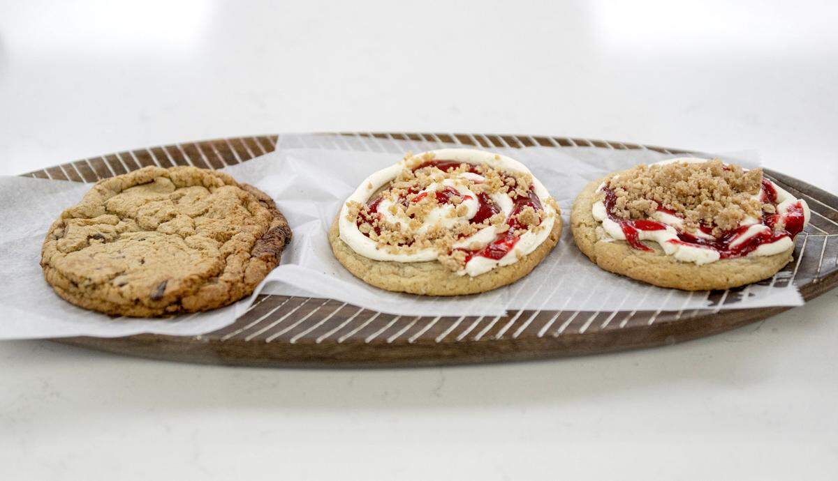 A chocolate chip cookie and two strawberry rhubarb cookies from Dulce Luca Cafe on Calder Way on Friday, July 19, 2024.