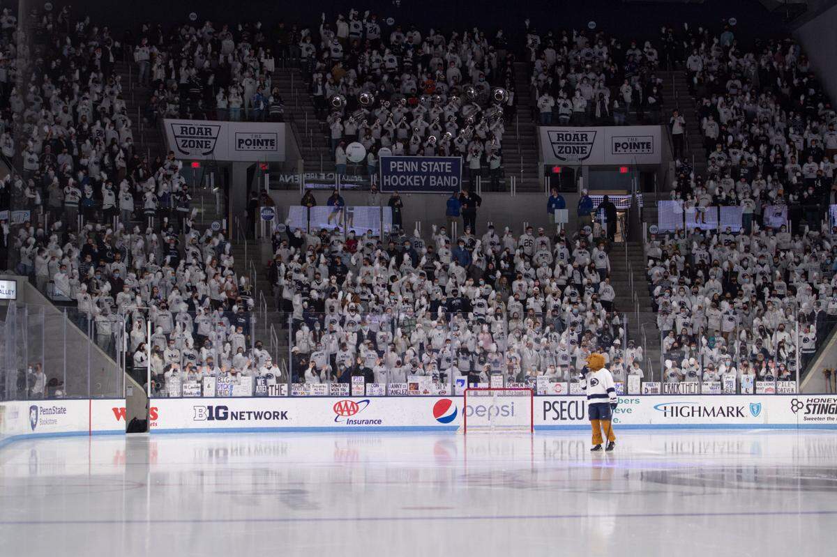 The Roar Zone, Penn State’s student section, cheers while the Nittany Lion skates during a NCAA Hockey match between Penn State and Ohio State at Pegula Arena on Saturday, Jan. 29, 2022 in University Park.