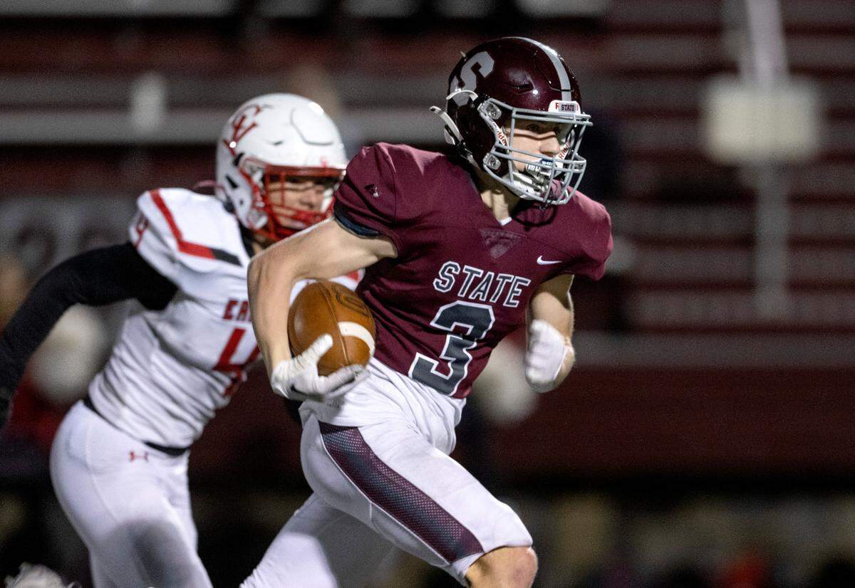 State College’s Ty Salazer runs for a touchdown ahead of a Cumberland Valley defender during the game on Friday, Oct. 21, 2022 at Memorial Field.