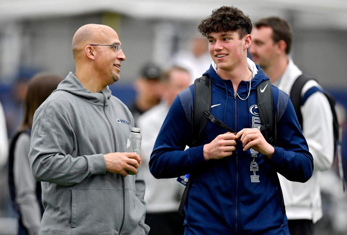 Penn State football coach James Franklin chats with freshman quarterback Drew Allar as he visits Penn State pro day on Thursday, March 24, 2022.