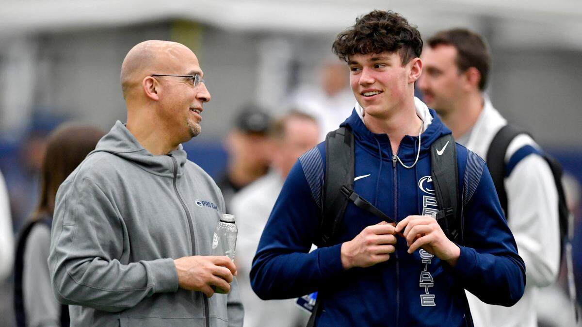 Penn State football coach James Franklin chats with freshman quarterback Drew Allar as he visits Penn State pro day on Thursday, March 24, 2022.
