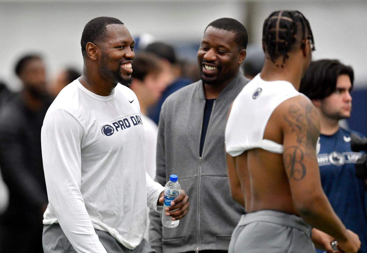 Arnold Ebiketie laughs with John Scott Jr. and Jaquan Brisker during Penn State pro day on Thursday, March 24, 2022.