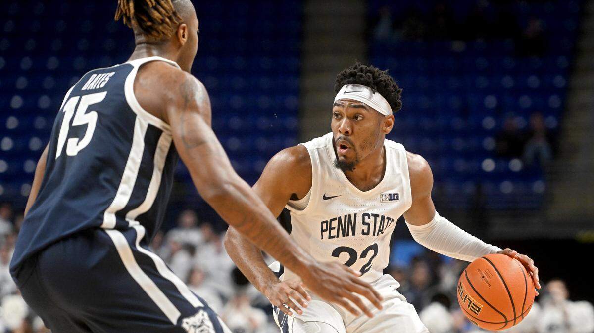 Penn State’s Jalen Pickett dribbles around Butler’s Manny Bates during the game on Monday, Nov. 14, 2022.