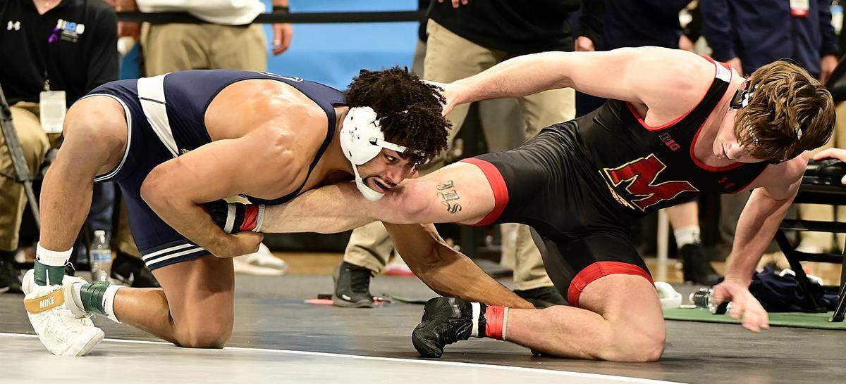 Penn State’s Carter Starocci aims to finish off a takedown of Maryland’s Jaxon Smith in their 184-pound semifinals match of the Big Ten championships on Saturday inside Welsh Ryan Arena in Evanston, Ill. Starocci topped Smith, 11-3.