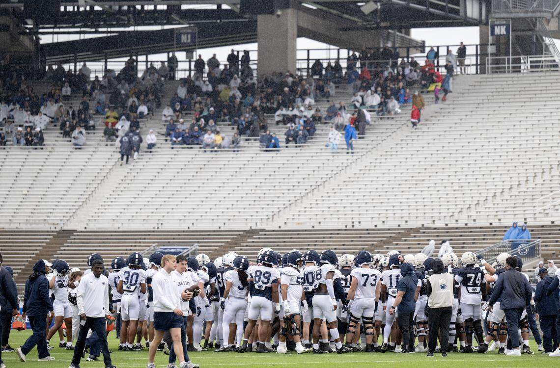 Fans sit under the overhang of the north stands to stay dry as they watch the Blue-White Practice on Saturday, April 25, 2026 in Beaver Stadium. 