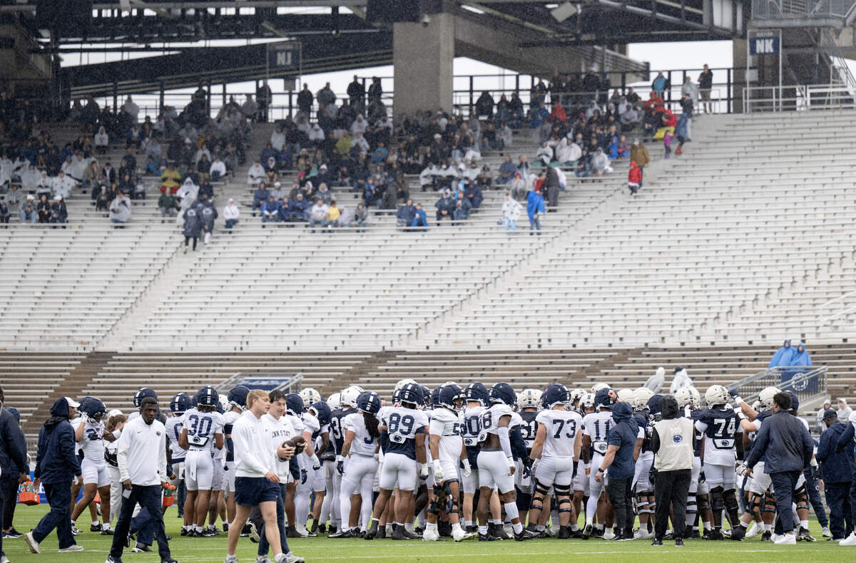 Fans sit under the overhang of the north stands to stay dry as they watch the Blue-White Practice on Saturday, April 25, 2026 in Beaver Stadium.